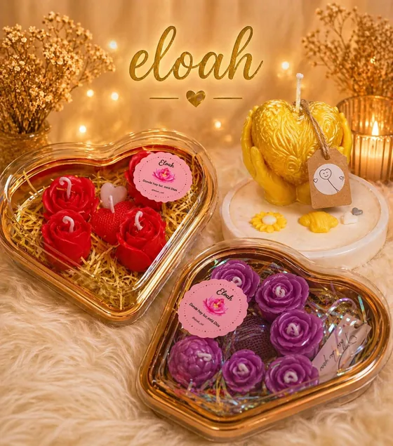 Cajas de corazón con velas de rosas en rojo y morado